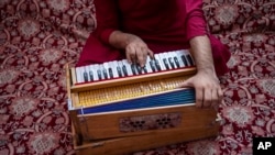 FILE - An Afghan musician plays the harmonium in Kabul, Afghanistan, on Sept. 16, 2021. Afghan musicians and singers in Pakistan received a temporary reprieve on Jan. 10, 2025, from a court that ruled they could not immediately be deported back to Afghanistan.