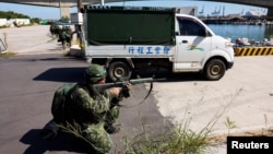 Soldiers take part in the first day of the annual Han Kuang military drills at a fishing port in Taoyuan, Taiwan, July 22, 2024.