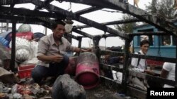 Pham Quang Thanh's fishing boat was allegedly attacked by Chinese vessels in the disputed South China Sea, Ly Son island, March 27, 2013.