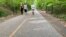 Joggers and walkers practice social distancing on Capital Crescent trail which connects Bethesda, Maryland, to Washington, D.C., May 27, 2020.
