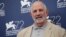 Director Brian De Palma poses at the photo call for the film De Palma and for the Glory To The Filmmaker Award 2015 at the 72nd edition of the Venice Film Festival in Venice, Italy, Sept. 9, 2015. 