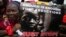 A woman holds a sign during a protest demanding the release of abducted secondary school girls from the remote village of Chibok, in Lagos, May 5, 2014.