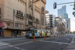 A lone tram on an empty Flinders Street is seen during lockdown in Melbourne, Australia, Aug. 5, 2020.