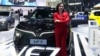 Vu Dang Yen Hang, chief executive officer of VinFast Thailand, poses in front of its electric vehicle VF7 during the 45th Bangkok Motor Show in Nonthaburi, Thailand, March 26, 2024.