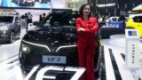 Vu Dang Yen Hang, chief executive officer of VinFast Thailand, poses in front of its electric vehicle VF7 during the 45th Bangkok Motor Show in Nonthaburi, Thailand, March 26, 2024.