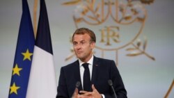 French President Emmanuel Macron delivers a speech during a ceremony in memory of the Harkis, Algerians who helped the French Army in the Algerian War of Independence, at the Elysee Palace in Paris, France, Sept. 20, 2020.