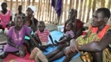 FILE - Recently displaced families who arrived five days before claiming that government troops attacked their towns, shelter in a run-down school in Akobo, near the Ethiopian border, in South Sudan, Jan. 19, 2018. 