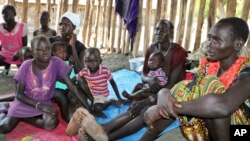 FILE - Recently displaced families who arrived five days before claiming that government troops attacked their towns, shelter in a run-down school in Akobo, near the Ethiopian border, in South Sudan, Jan. 19, 2018. 