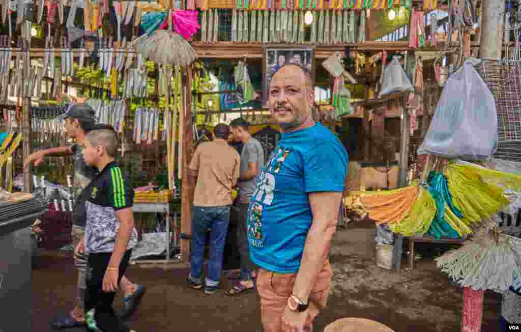 Ashour Al-Sanan, who have been trading in butchery-tools for 25 years in Old Cairo, says, &quot;Only the prices of meat dropped down, but the prices of everything else raised, I think that is why the turnout this year is not like past years.&quot; (H. Elrasam/VOA)