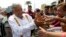 Presidential hopeful and two-time candidate Andres Manuel Lopez Obrador greets supporters as he arrives at a campaign rally for Delfina Gomez, who is running for Mexico state governor with his National Regeneration Movement, or MORENA, in Nezahualcoyotl, Mexico state, May 28, 2017.