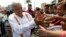 FILE - Presidential hopeful and two-time candidate Andres Manuel Lopez Obrador greets supporters as he arrives at a campaign rally for Delfina Gomez, who is running for Mexico state governor with his National Regeneration Movement, or MORENA, in Nezahualcoyotl, Mexico state, May 28, 2017.