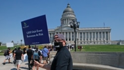 FILE - Special events workers who were forced out of work because of the COVID-19 pandemic marched, July 21, 2020, in Salt Lake City.