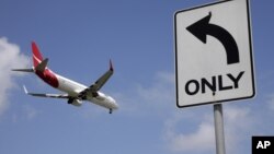 FILE - A Qantas plane prepares to land at Sydney Airport, at Sydney, Australia, Feb. 21, 2013. A Boeing 787-9 Dreamliner, operated by Qantas Airways, arrived Sunday in London just over 17 hours after setting off from the western Australian city of Perth.