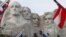 FILE - Flags frame the presidents on the Mount Rushmore monument, Dec. 9, 2016, near Keystone, S.D.