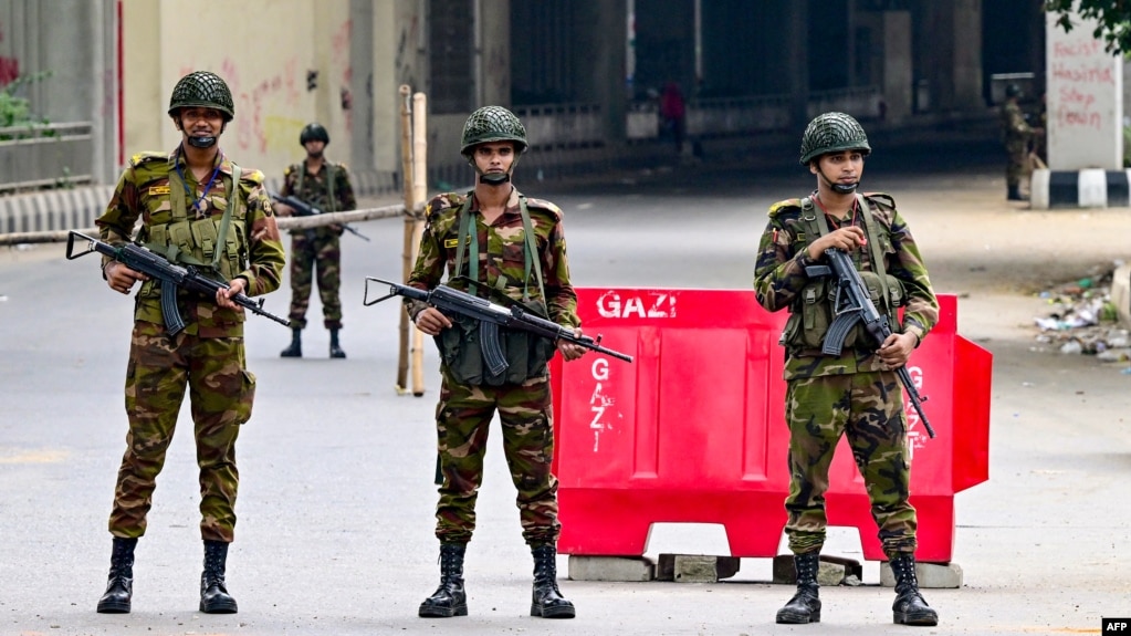 Bangladesh army personnel stand guard during a curfew following clashes between police and Anti-Discrimination Student Movement activists amid anti-government protests in the Shahbag area of Dhaka on Aug. 5, 2024.