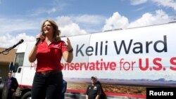 FILE - Kelli Ward campaigns at the Gunsite academy in her bid to become the Republican nominee for an open U.S. Senate seat in Paulden, Arizona, Aug. 24, 2018. 