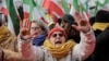 Supporters of the People's Mujahedin of Iran People show their hands with stickers reading "Our choice, Maryam Rajavi" during a demonstration called by members of the Iran opposition to call for justice, human rights and freedom for the Iranian people in Paris, Feb. 8, 2025.