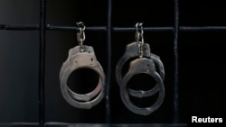 Handcuffs hang in a Hamas-run prison where alleged collaborators with Israel are held in Gaza City April 23, 2013. The Islamist Hamas government, which is pledged to Israel's destruction by force of arms, is lauding a recent campaign to root out informant