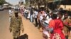 Protesting journalists line up outside the National Council for Press and Publications building in Khartoum, Sudan, Dec. 29, 2016.