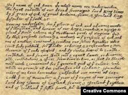 The Mayflower Compact, the first governing document of Plymouth Colony, signed November 11 in what is now Providence Harbor, Massachusetts.