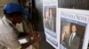 A newspaper vendor sets up his stall outside court ahead of South African "Blade Runner" Oscar Pistorius' court appearance in Pretoria February 15, 2013. 