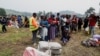 Congolese civilians who fled from Goma, eastern Democratic Republic of Congo following gather at a reception center in Rugerero near Gisenyi, in Rubavu district, Rwanda, Jan. 28, 2025. 