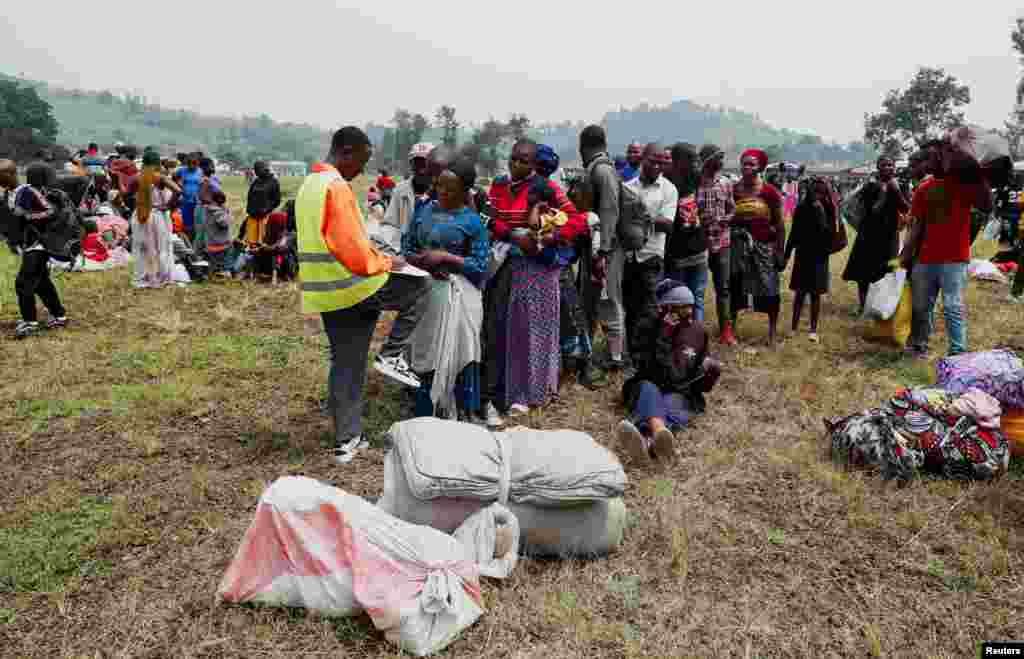 Congolese civilians who fled from Goma, gather at a reception center in Rugerero near Gisenyi, in Rubavu district, Rwanda, Jan. 28, 2025.