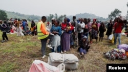 Congolese civilians who fled from Goma, eastern Democratic Republic of Congo following gather at a reception center in Rugerero near Gisenyi, in Rubavu district, Rwanda, Jan. 28, 2025. 