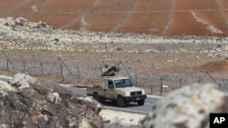 FILE - Jordanian soldiers patrol along the eastern Jordan-Syria border, in al-Washash, Mafraq governorate, Jordan, Thursday, Feb. 17, 2022. Jordan is believed to have carried out an airstrike against drug traffickers in Syria on Jan. 18, 2024.