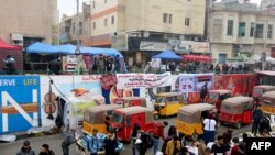 Iraqi protesters gather in Tahrir square in the capital Baghdad, on December 15, 2019, amid ongoing anti-government demonstrations. - Iraq's capital and Shiite-majority south have been gripped Since October 1, by rallies.