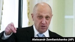 RUSSIA -- Businessman Yevgeny Prigozhin gestures on the sidelines of a summit meeting between Russian President and Turkish President at the Konstantin palace outside St. Petersburg, Aug. 9, 2016.