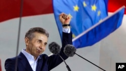 FILE - Multibillionaire Bidzina Ivanishvili, creator of the Georgian Dream party, greets demonstrators during a rally in support of a "foreign agent" law in Tbilisi, Georgia, on April 29, 2024.