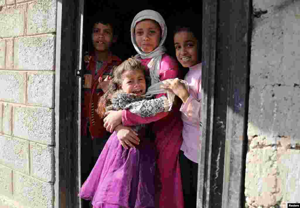 A girl reacts after she was administered with polio vaccine during a house-to-house vaccination campaign in Sana&#39;a, Yemen, Dec. 25, 2019.