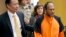 FILE - Jose Ines Garcia Zarate, right, is led into the courtroom by San Francisco Public Defender Jeff Adachi, left, and Assistant District Attorney Diana Garcia, center, for his arraignment in San Francisco, July 7, 2015.