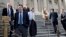 Rep. Raul Labrador (2nd from L) and members of the House of Representatives leave after the Republican-controlled House voted to let insurance companies sell individual health coverage to all comers, even if it falls short of required standards in "Obamac