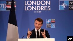 FILE - French President Emmanuel Macron speaks during a media conference at the conclusion of a NATO leaders meeting in Watford, Hertfordshire, England, Dec. 4, 2019.