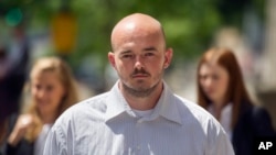 FILE - Former Blackwater guard Nicholas Slatten leaves federal court in Washington, June 11, 2014.