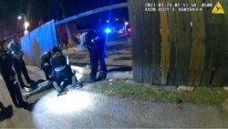 This March 29, 2021, photo from Chicago Police bodycam video shows Chicago Police performing CPR on 13-year-old Adam Toledo after being shot by Chicago Police in Chicago.