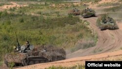 FILE - Soldiers conduct military exercises near Sankt Petersburg, Russia, Aug. 17, 2018. 