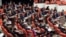 The newly elected lawmakers from pro-Kurdish Peace and Democracy Party, last two rows, sit  the parliament with the members of other parties in Ankara, Turkey, October 1, 2011. 