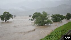 Rising water caused by heavy rain is seen at Kuma river in Yatsushiro, Kumamoto prefecture, on July 4, 2020.