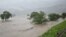 Rising water caused by heavy rain is seen at Kuma river in Yatsushiro, Kumamoto prefecture, on July 4, 2020.