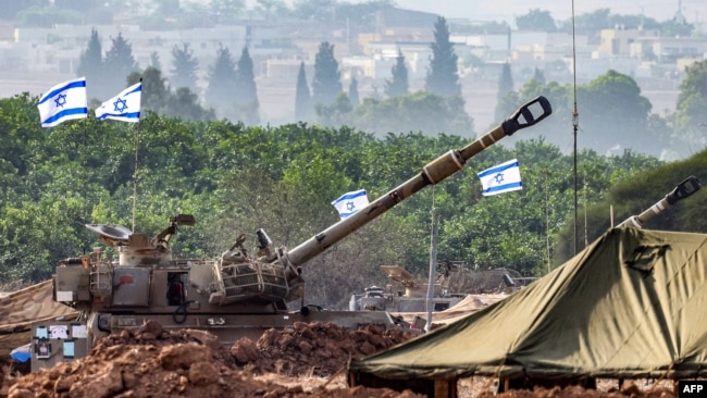 An Israeli army M109 155mm self-propelled howitzer is deployed at a position along the border with the Gaza Strip near Sderot in southern Israel on Oct. 27, 2023, amid ongoing battles between Israel and the Palestinian Hamas movement.