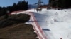 FILE - A view of the men's World Cup giant slalom race, in Adelboden, Switzerland, Jan. 7, 2023. Sparse snowfall and unseasonably warm weather in much of Europe allowed green grass to blanket many mountaintops across the region.