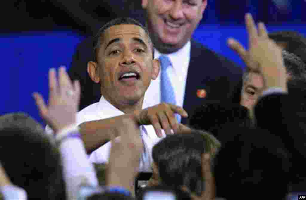 President Barack Obama greets supporters after his speech at the University of Michigan in Ann Arbor, Mich., Friday, Jan. 27, 2012. (AP Photo/Carlos Osorio)