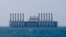 A floating power station waits off the coast at Jiyeh, south of Beirut, Lebanon, July 16, 2018.