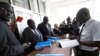 Gay and human rights activists (L) file a constitutional petition against a new anti-homosexuality law, at the courts in Uganda's capital Kampala, March 11, 2014.