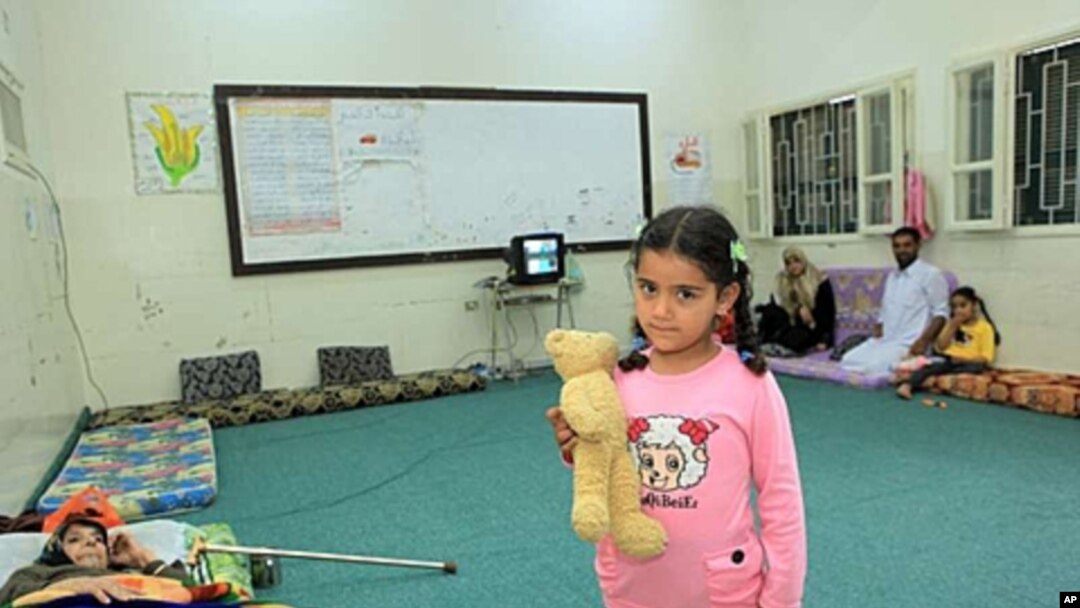 Five-year-old Razan's home in Misrata, Libya, was destroyed by a missile. She now lives in a school in the city with her parents, sister and 76-year-old diabetic grandmother.