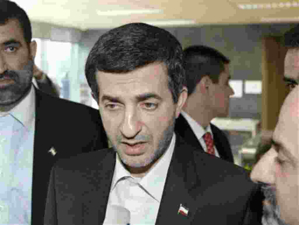 The Iranian vice-president Rahim Mashaei, centre, talks to reporters after leaving a private meeting with Spain's foreign minister Miguel Angel Moratinos in Madrid, Tuesday, Feb. 6, 2007. (AP Photo/Paul White)