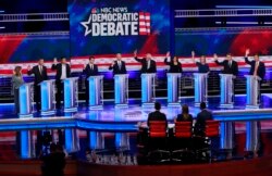 Among the Democratic presidential candidates on stage at the debate held in Miami, June 27, 2019, were former Colorado Gov. John Hickenlooper and N.Y. Sen. Kirsten Gillibrand.
